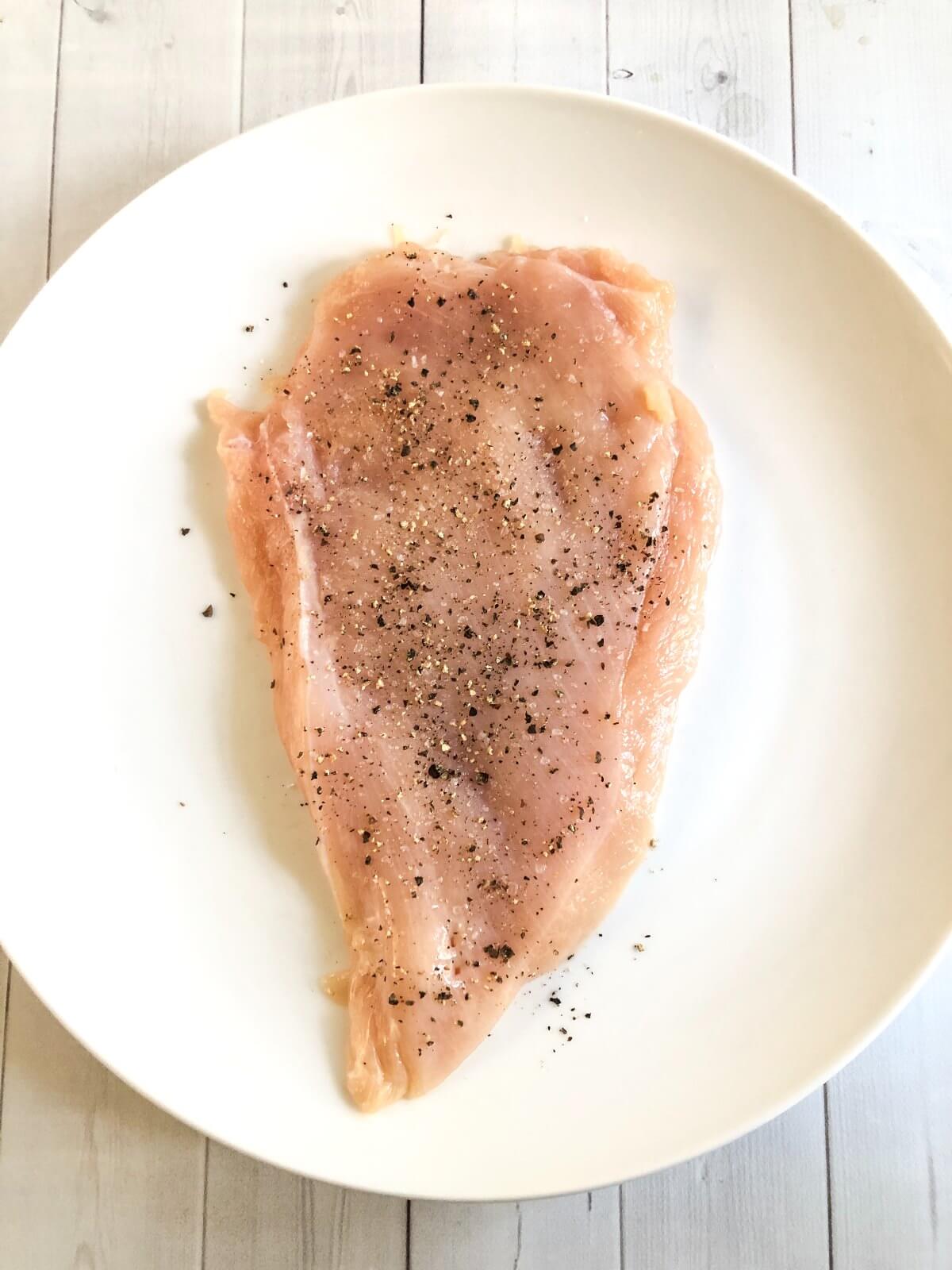 RAW CHICKEN BREAST WITH SALT AND PEPPER