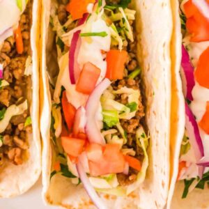 pork tacos with vegetable toppings