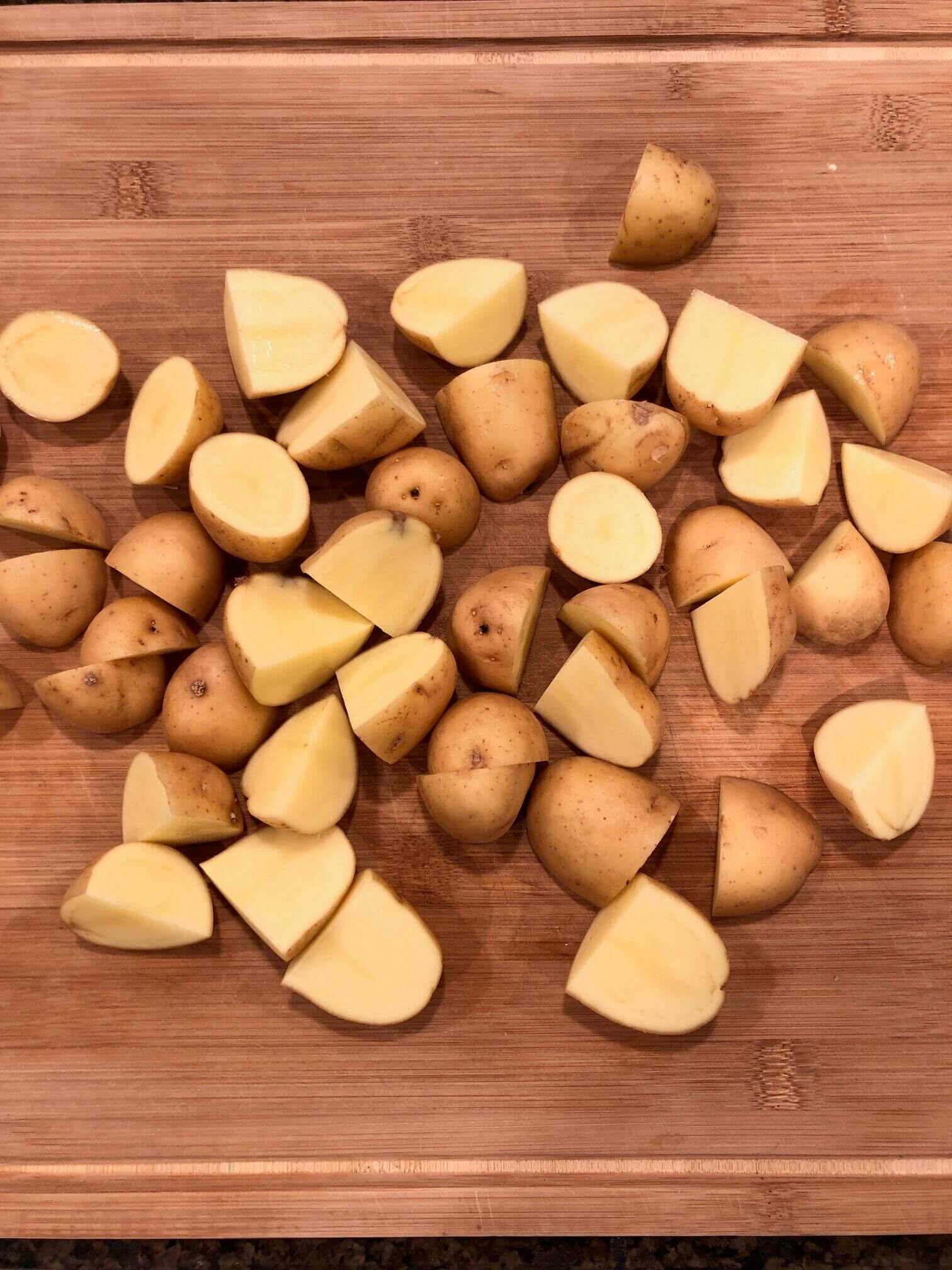 One pound of potatoes, cut into quarters