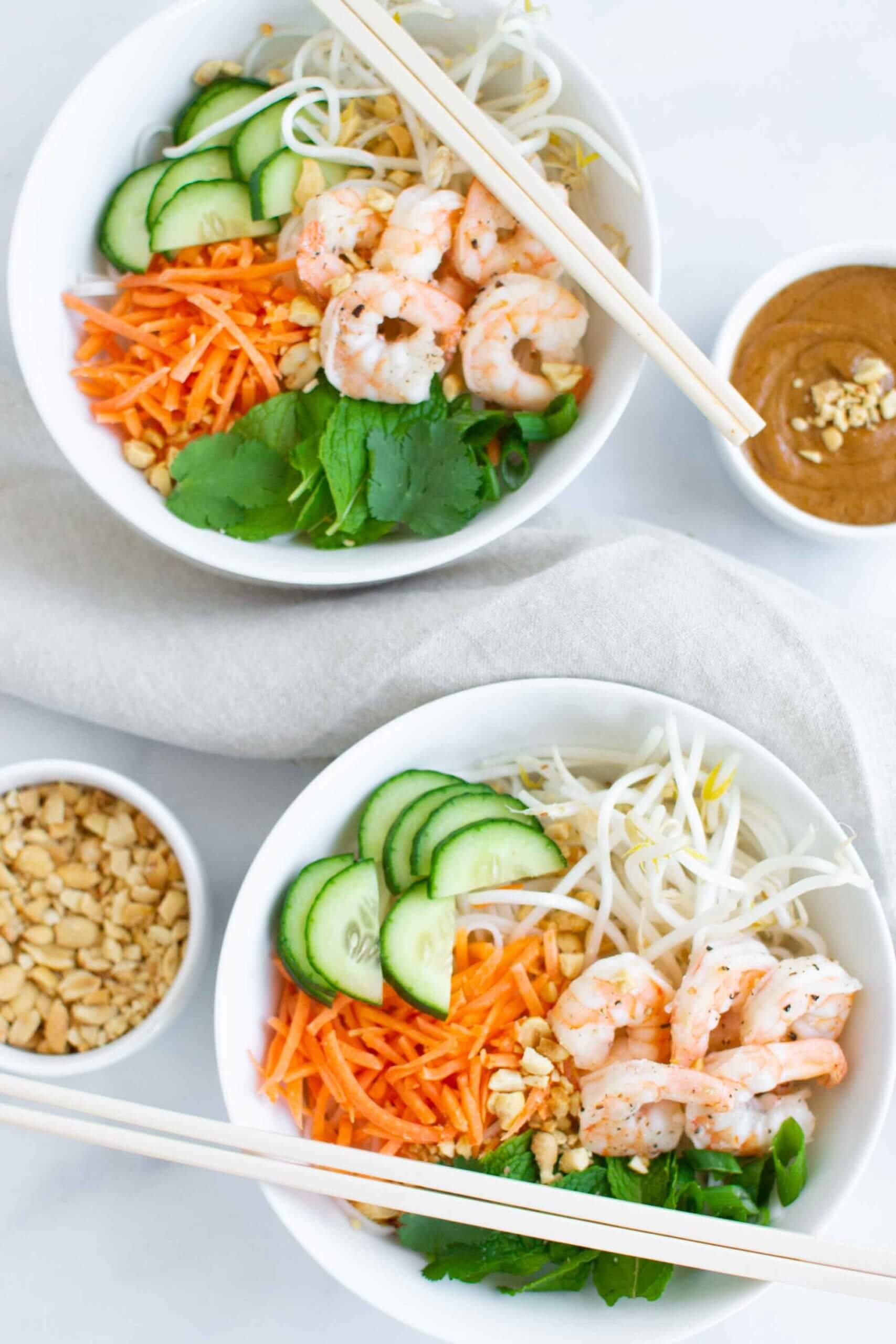 Vietnamese summer roll noodle bowl with peanuts, cucumber, fresh herbs and shrimp. 