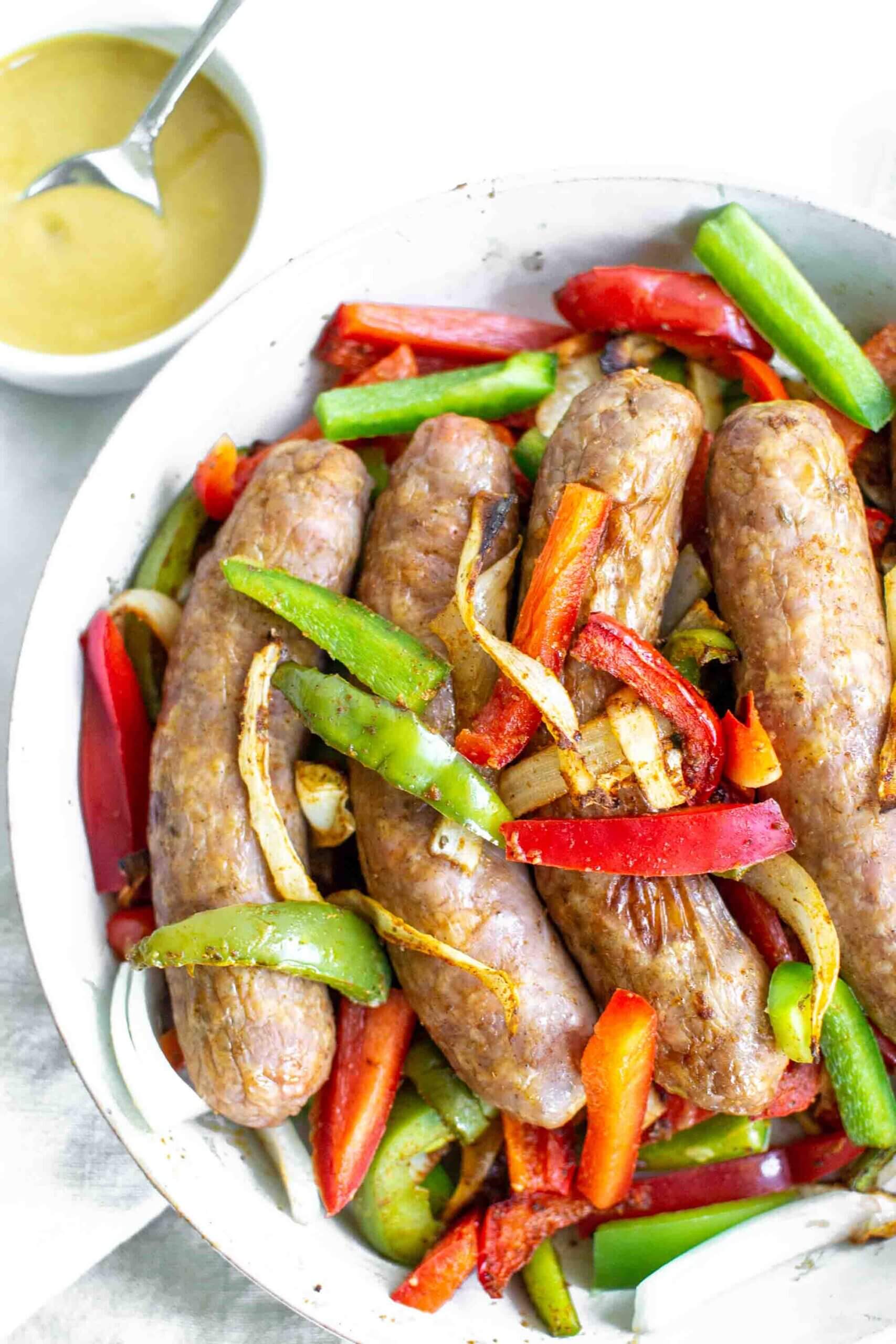 Air Fryer Sausage and Peppers on a plate with honey mustard sauce