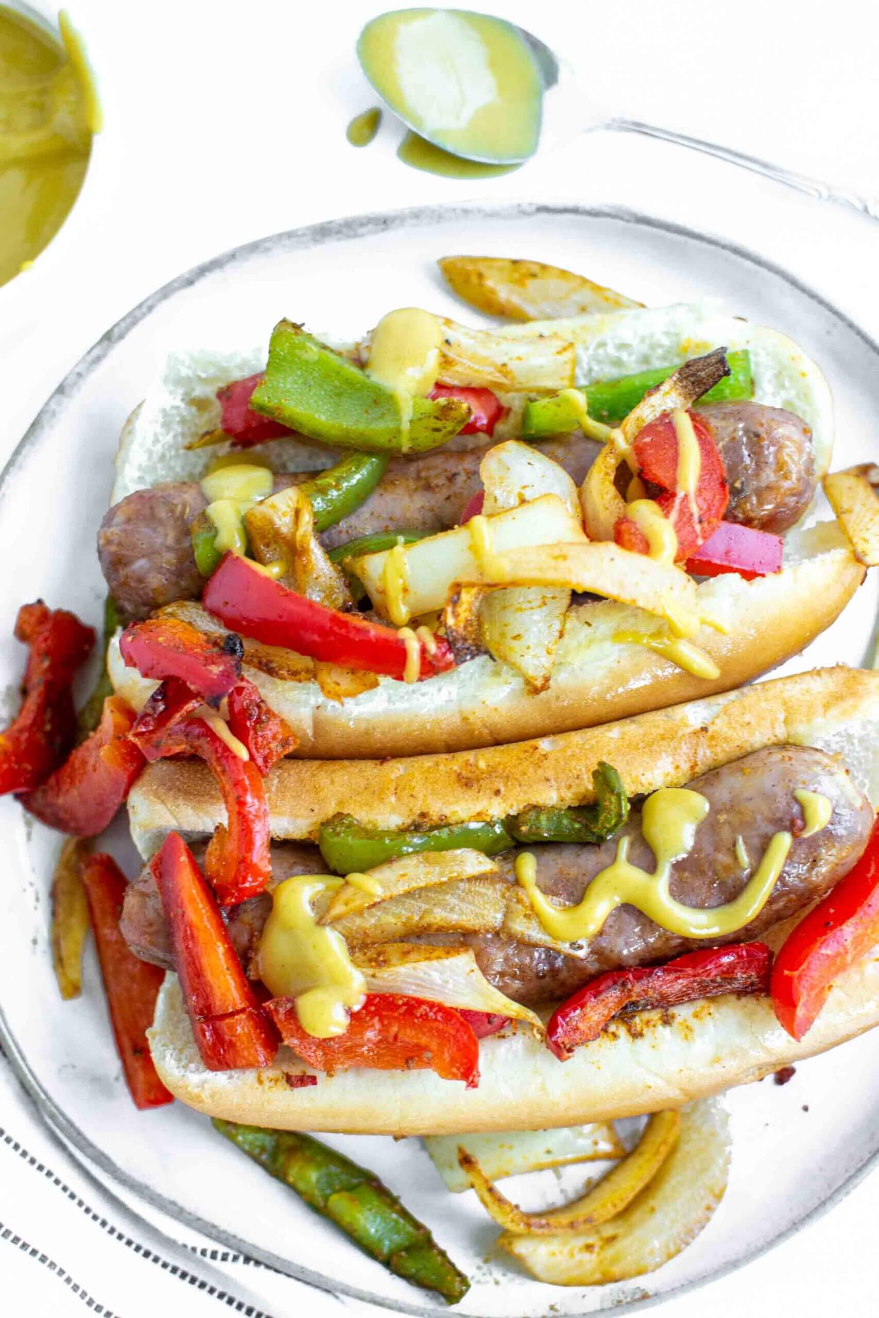 Air Fryer Sausage and Peppers on a buns with honey mustard sauce