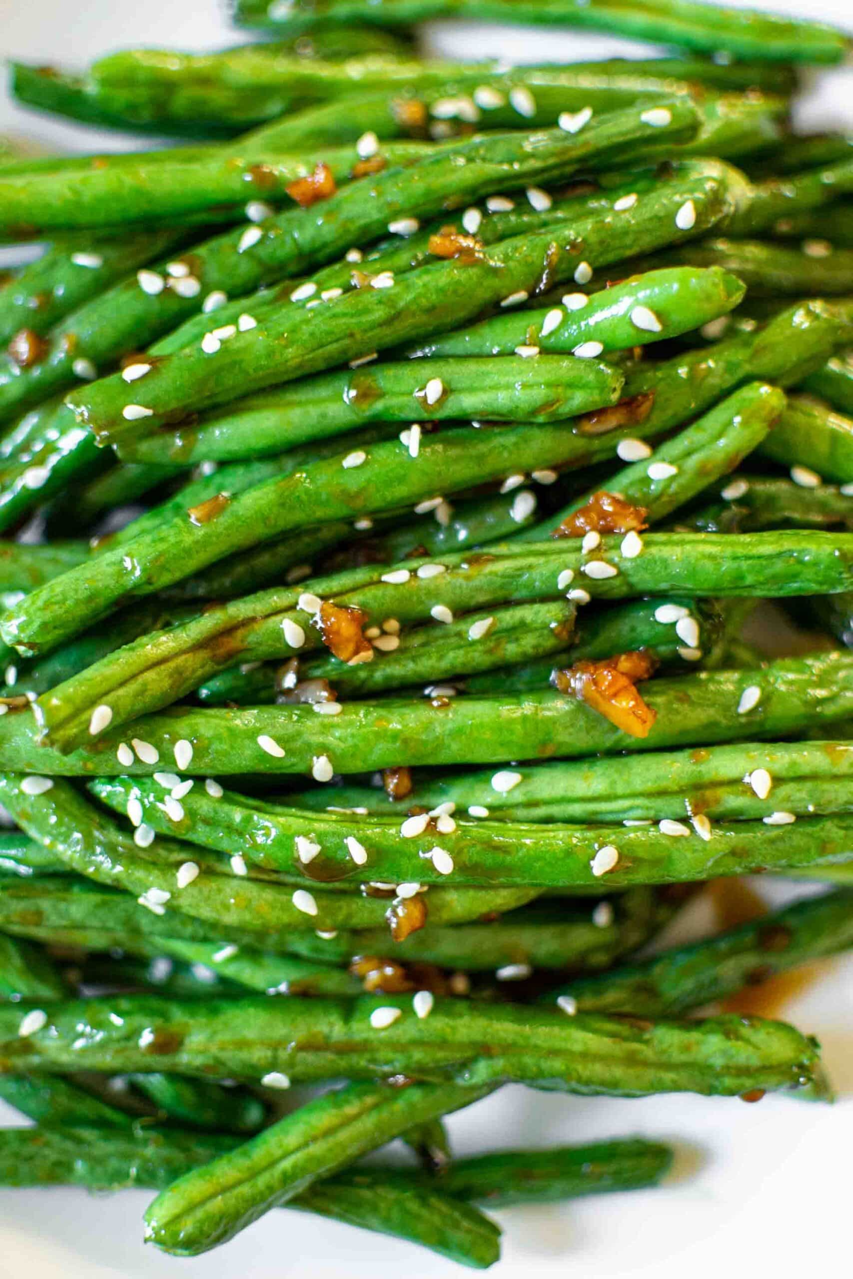Chinese Style Air Fryer Green Beans on a plate with sesame seeds.