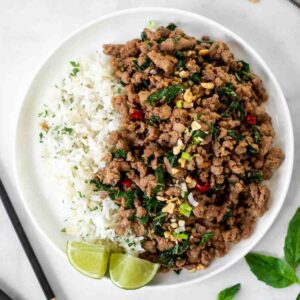 Easy Thai Basil Pork Stir Fry with white rice and lime