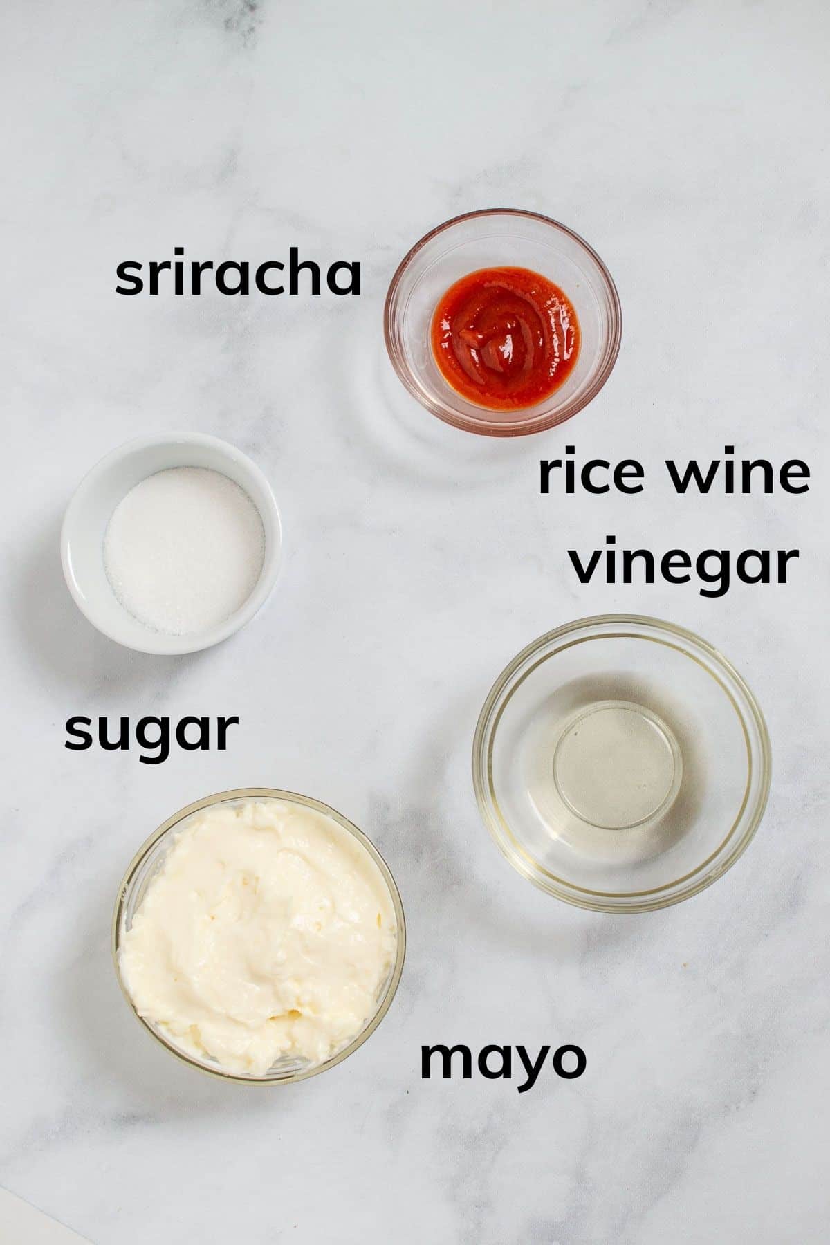 Ingredients needed to make sriracha mayo.