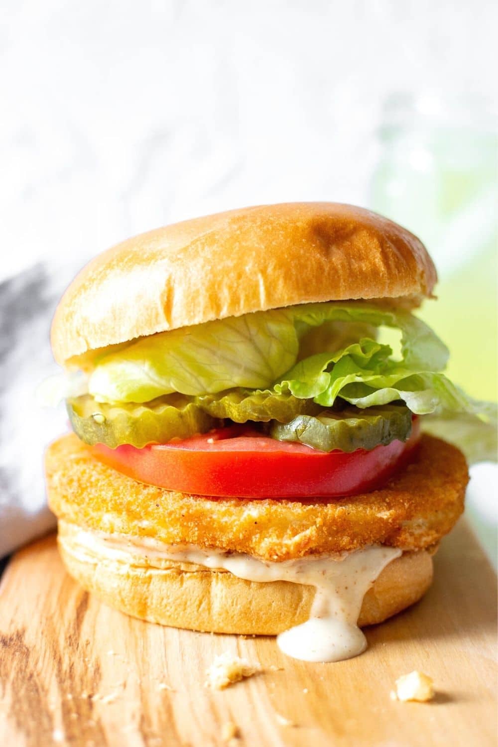 Air fryer frozen chicken burger with tomato, lettuce and pickles