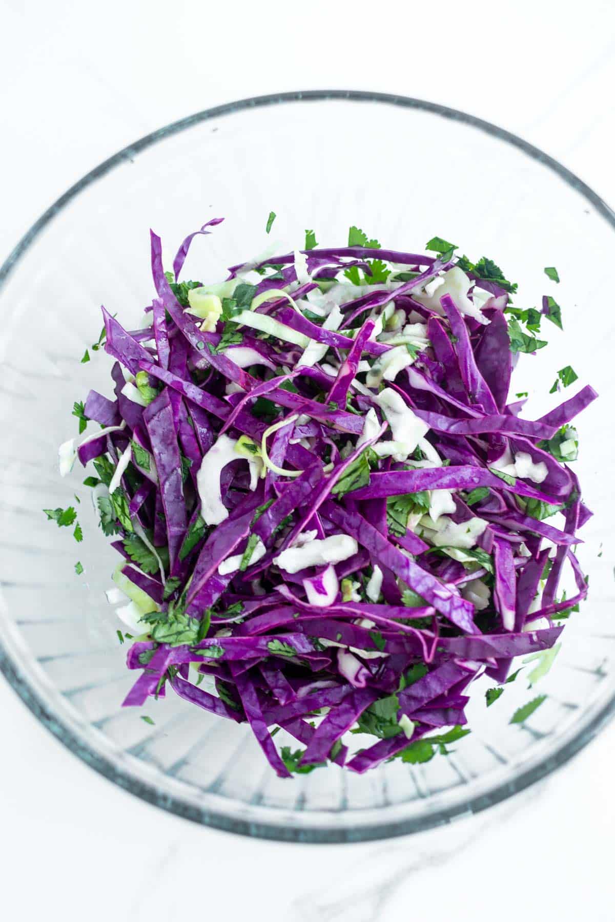 Slaw for Spicy Ground Pork Tacos in a glass bowl