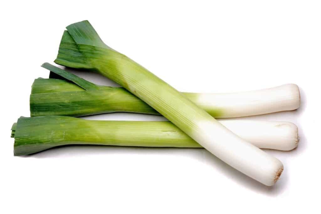 3 leeks on a white background