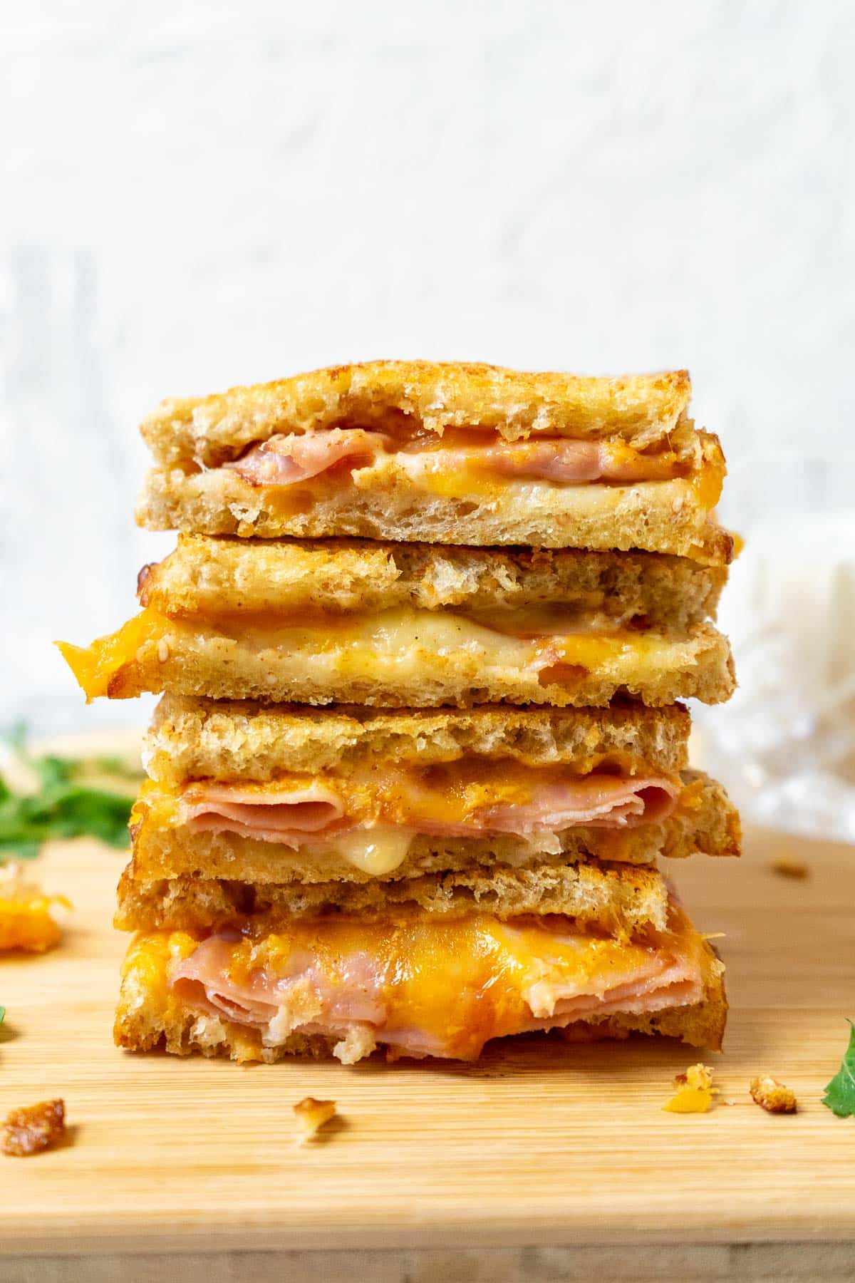 Air Fryer Grilled Ham and Cheese sandwiches with multiple pieces stacked on top of each other. 