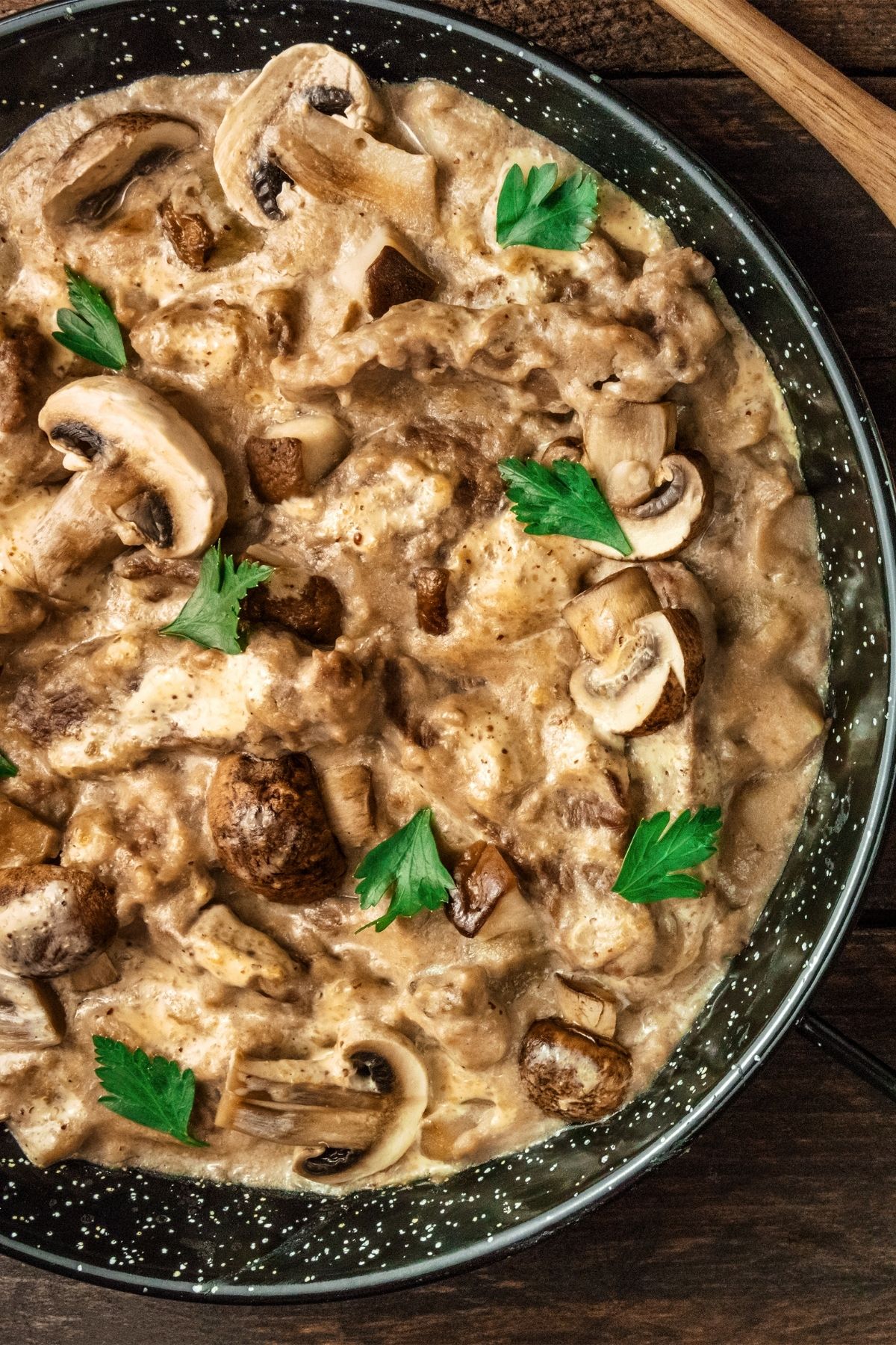 A pan of beef stroganoff with lots of mushrooms.
