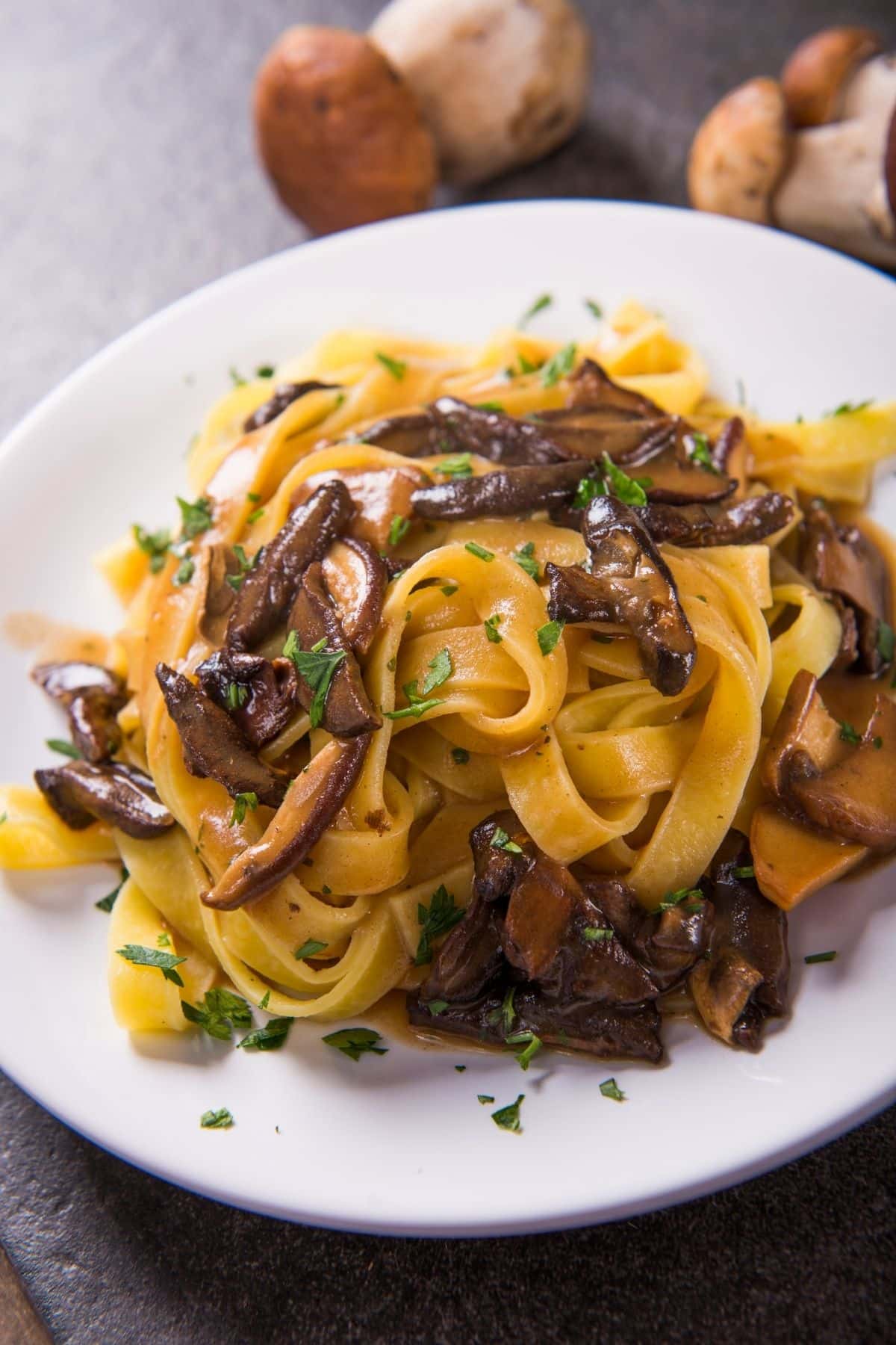 A bowl of pasta with mushrooms.