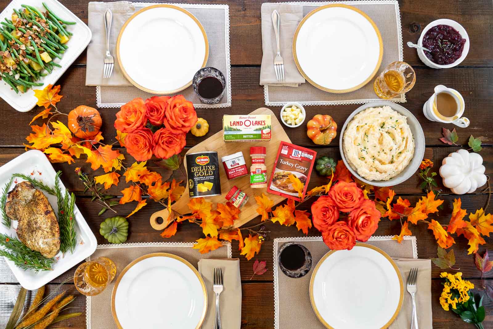 Easy Thanksgiving menu for a small gathering table scape with decorated table and all food and 4 place settings.
