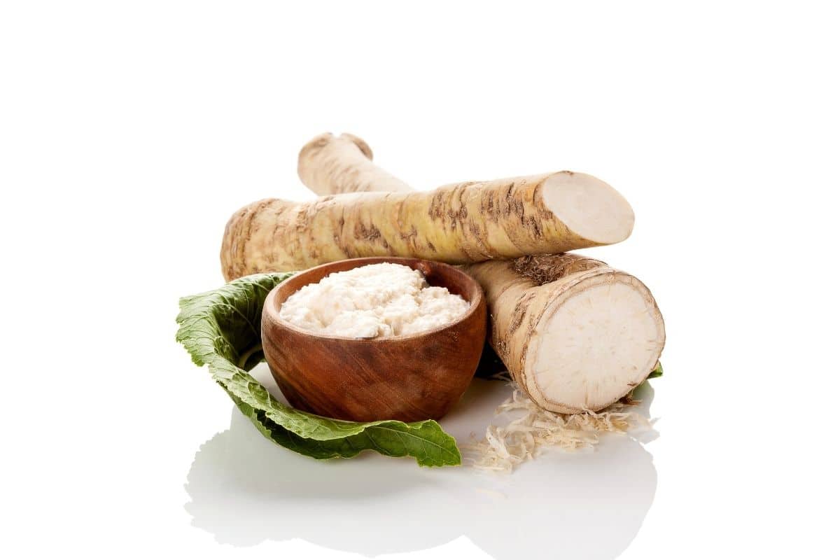 10 substitutes for horseradish--a horseradish root and wooden bowl of prepared horseradish