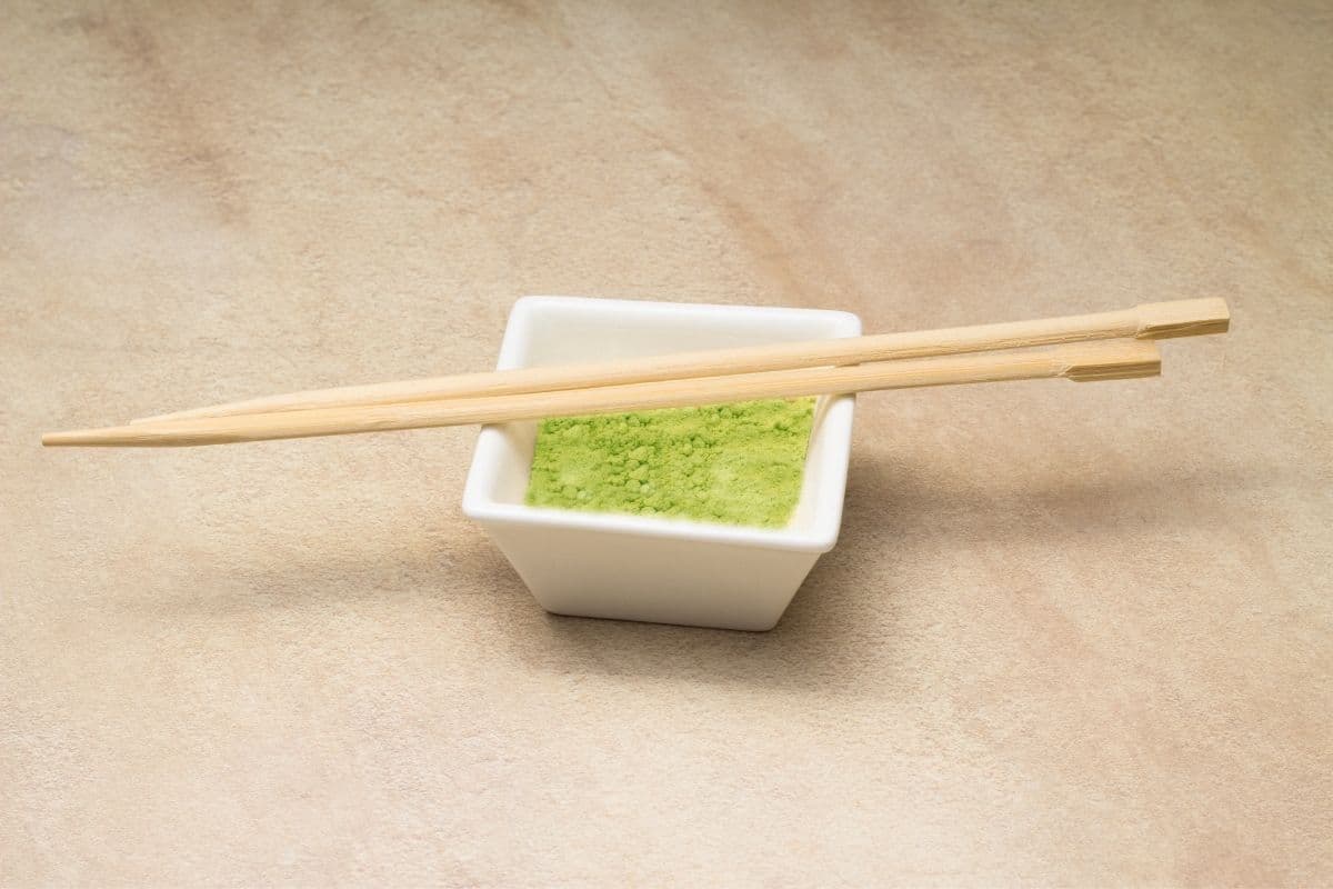 Wasabi powder in a small dish with chopsticks