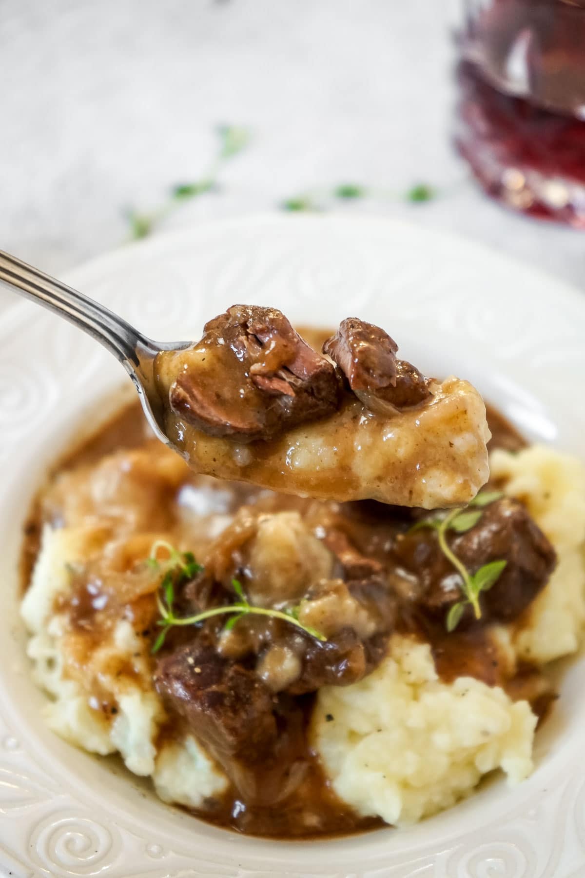 Close up of a fork with beef tips in gravy cooked in the instant pot.