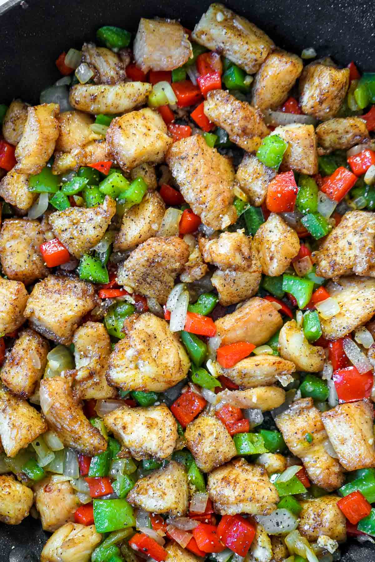 Close of up Chinese salt and pepper chicken in the skillet.