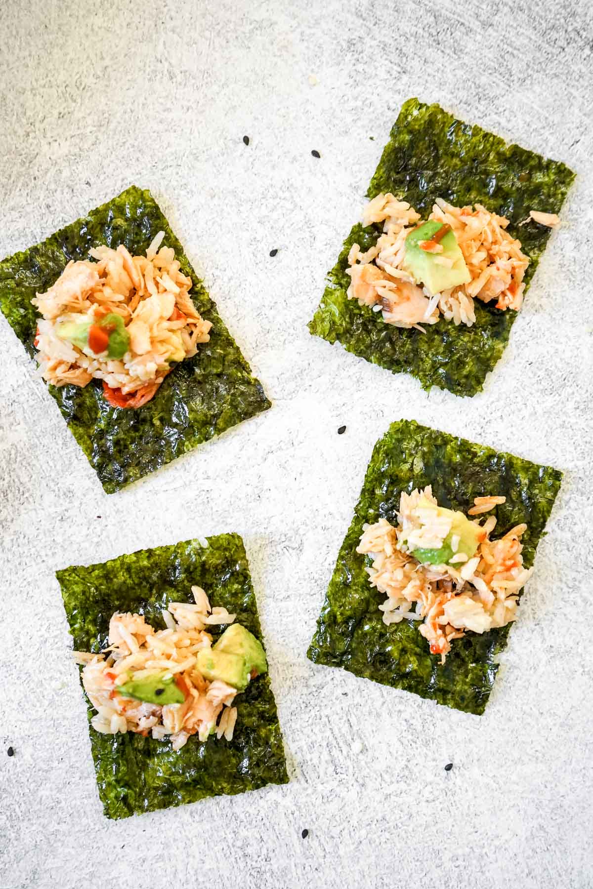 TikTok Rice Bowl with Salmon on 4 mini seaweed pieces like little sushi rolls.