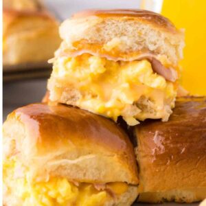Hawaiian roll breakfast sliders stacked on top of one another.