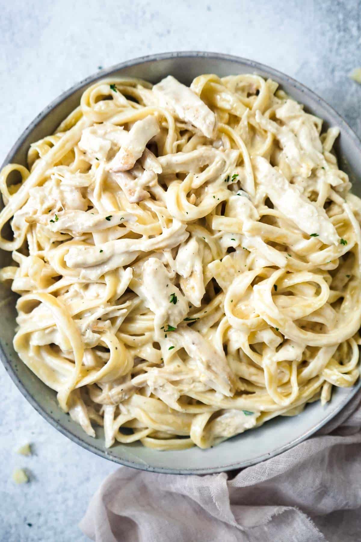 Creamy garlic parmesan chicken pasta in a large pasta bowl. 
