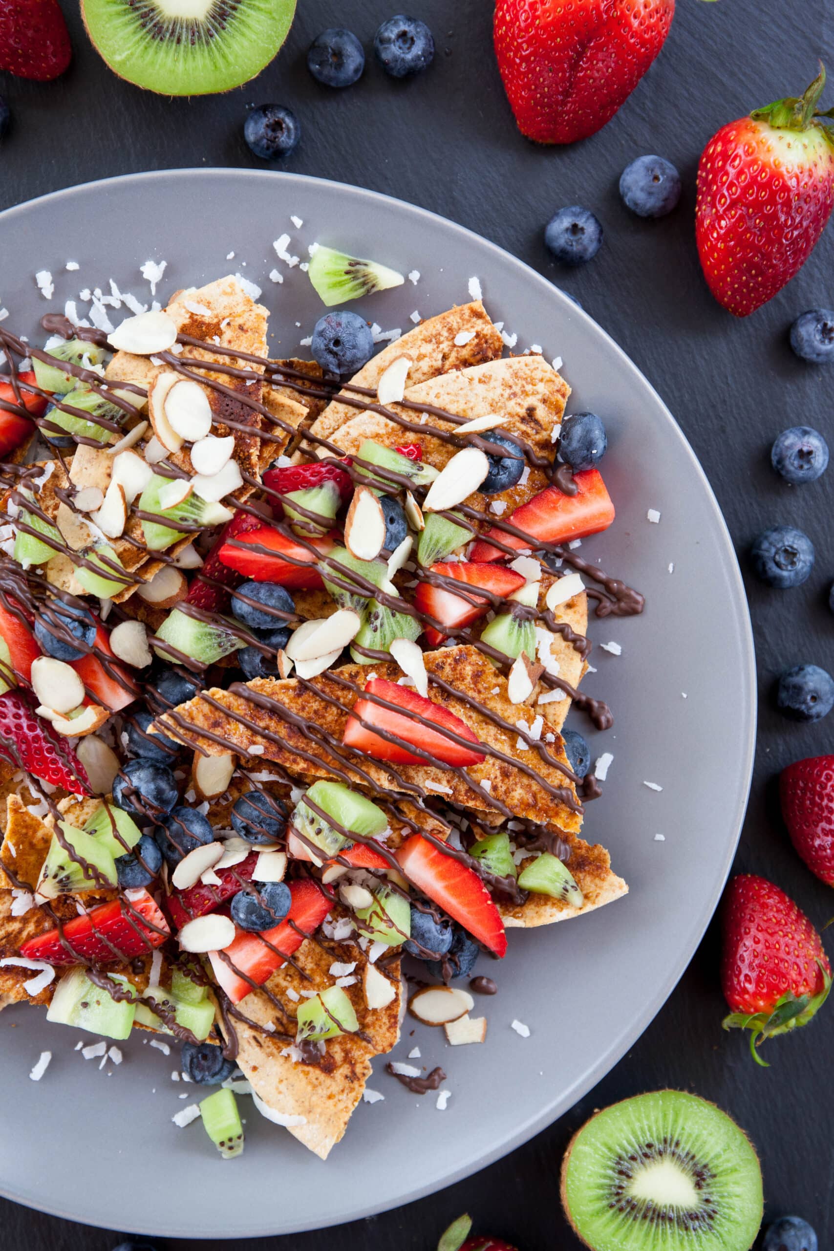 A large plate of fruit nachos.