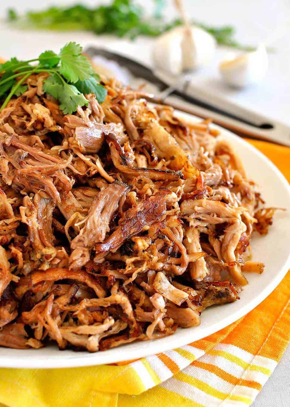 A plate of carnitas cooked in the slow cooker.