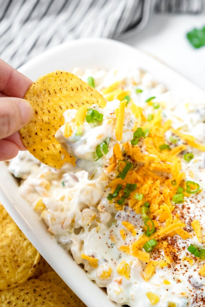 Bacon and corn crack dip with chips.