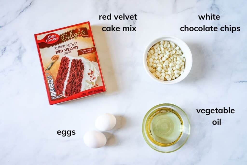 Ingredients needed to make red velvet brownies with white chocoate chips.