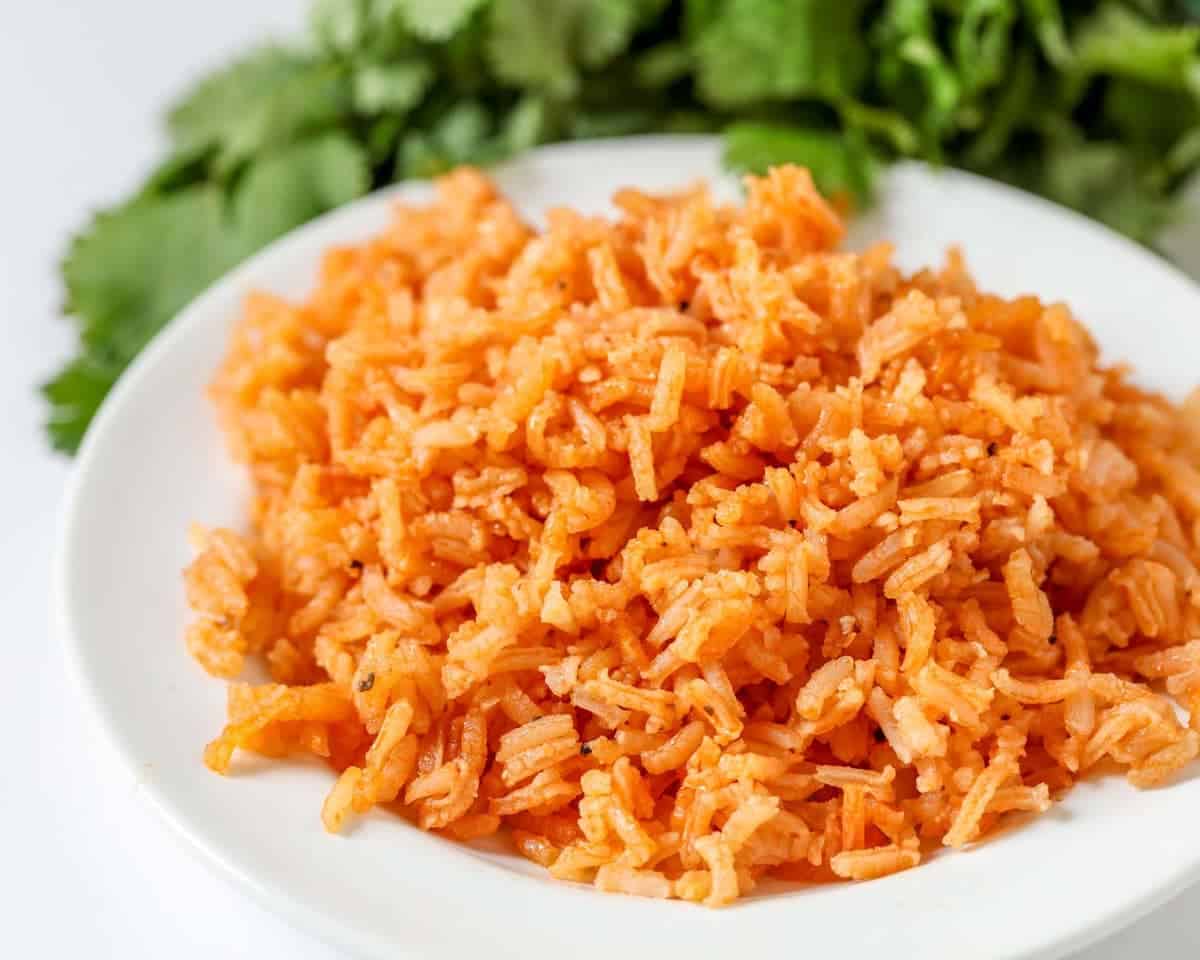 A white plate of Mexican rice.