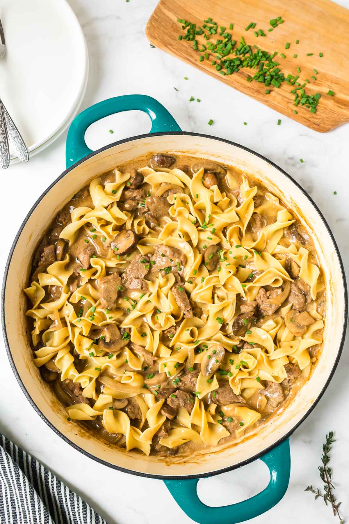 A big pan filled with easy beef stroganoff without sour cream, with egg noodles. 