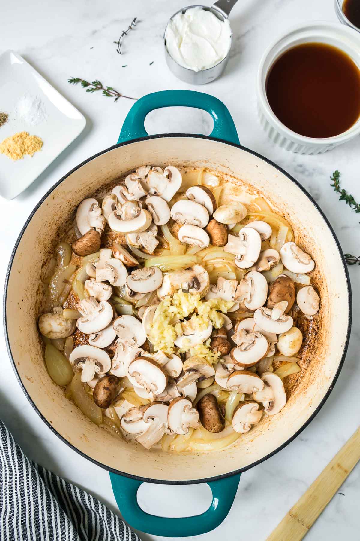 Mushrooms, garlic and onions in a large pan.