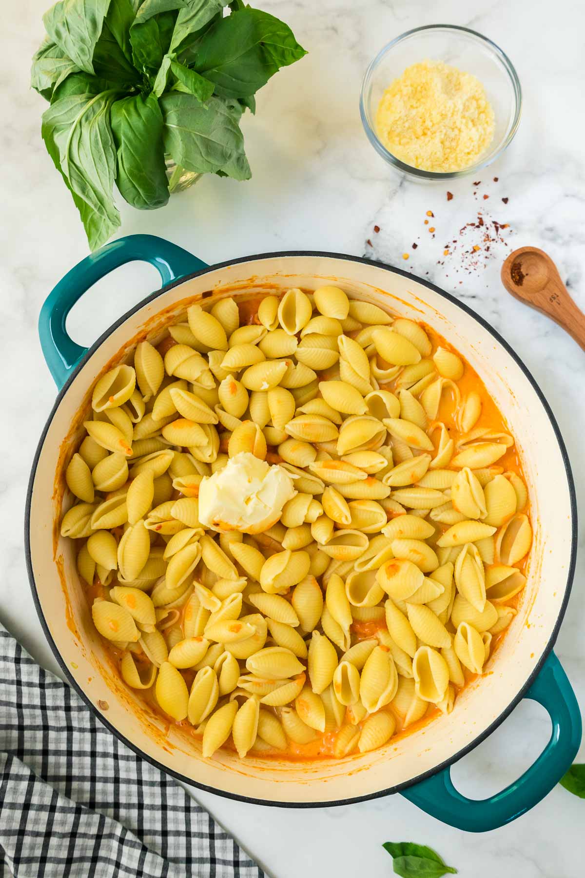 Vodka pasta with butter and sauce in a large pan.