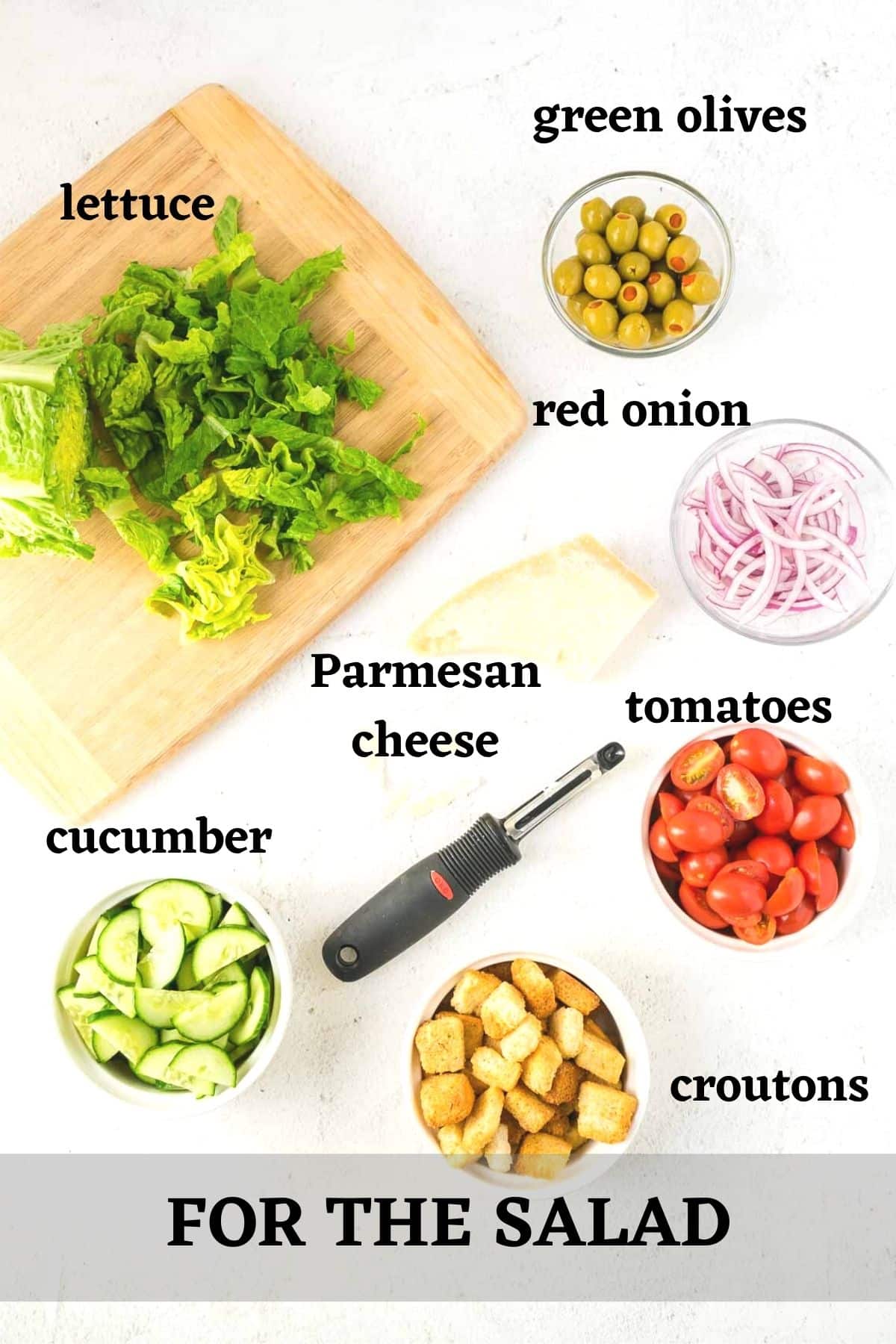 Ingredients to make a tossed green salad for a crowd.