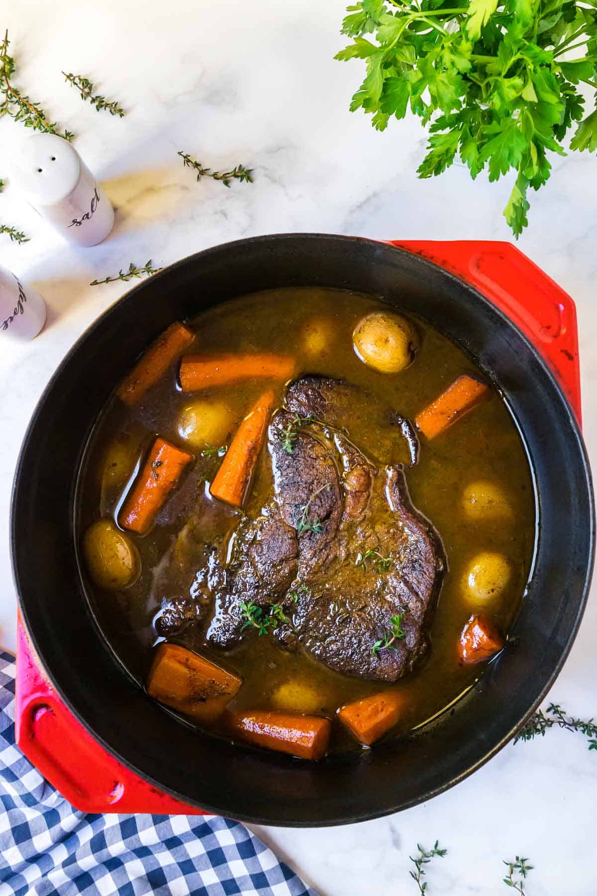 Old-fashioned pot roast in a Dutch oven after cooking.