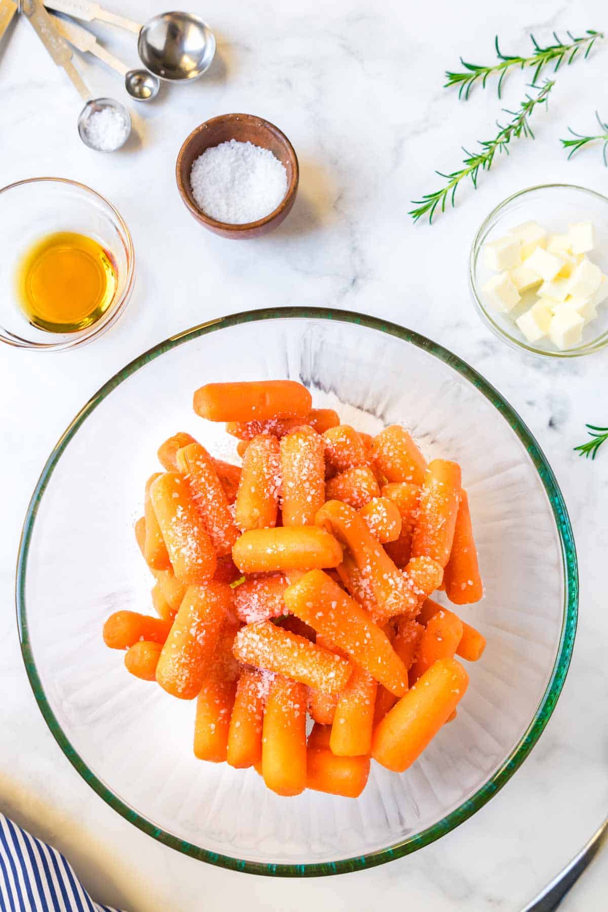 Baby carrots in a bowl with sea saly