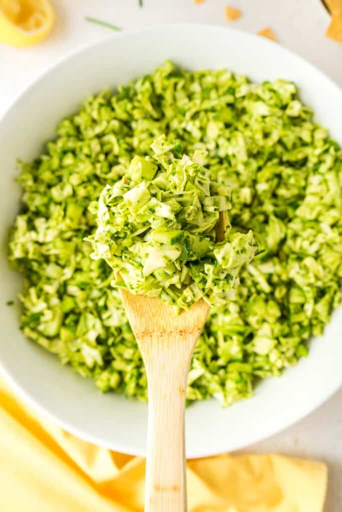 Photo of tik tik green goddess salad on a spoon.