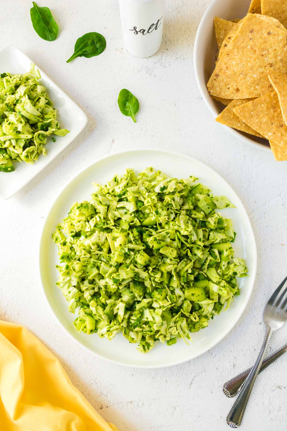 A plate of the viral Tik Tok green goddess salad with tortilla chips on the side.