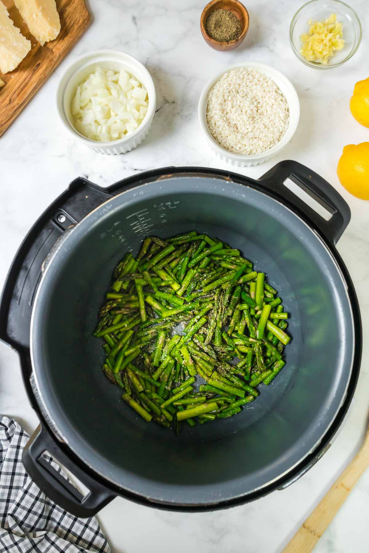 Asparagus cooking in an Instant Pot.