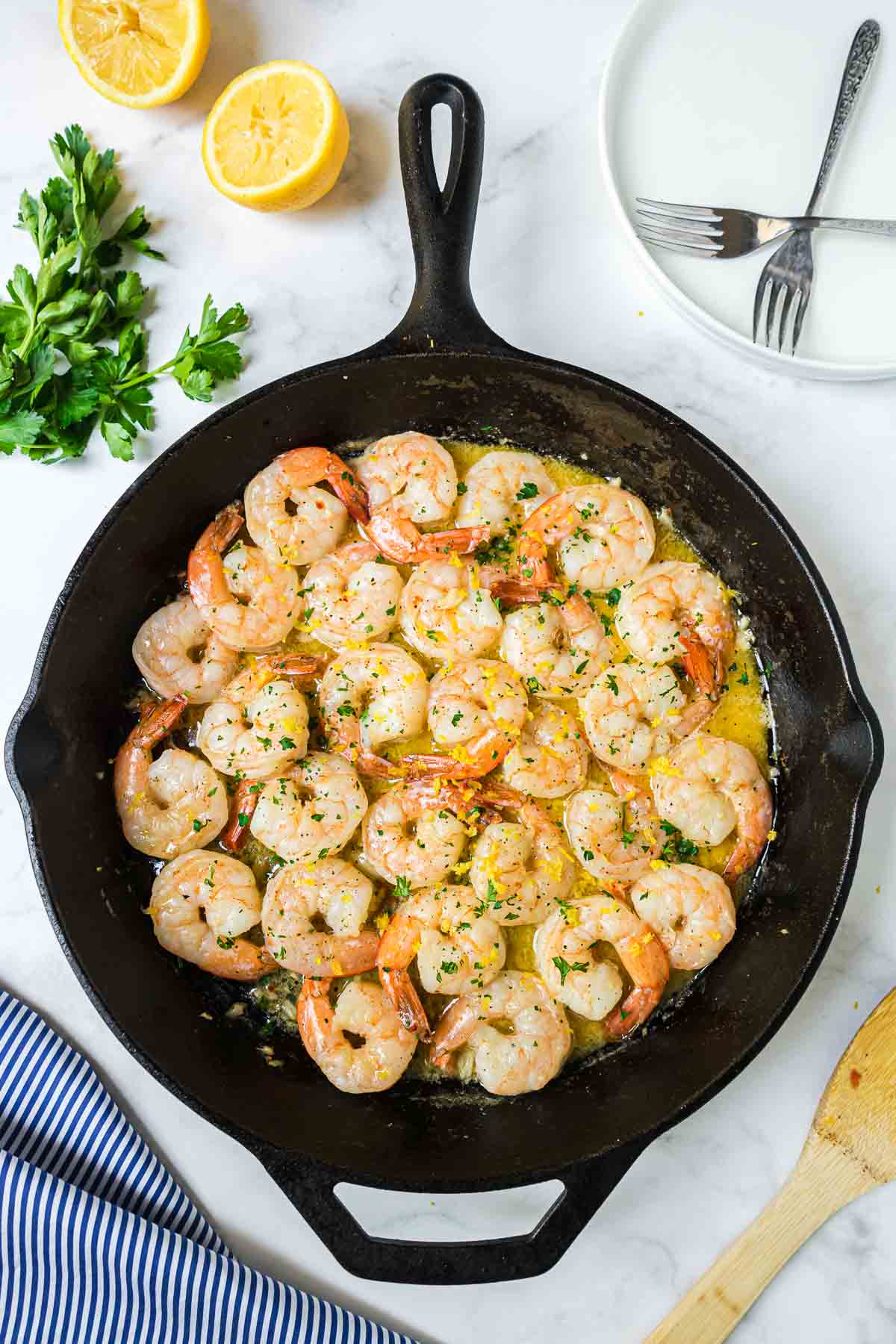 Easy Shrimp Scampi Recipe in a large skillet garnished with chopped parsley.