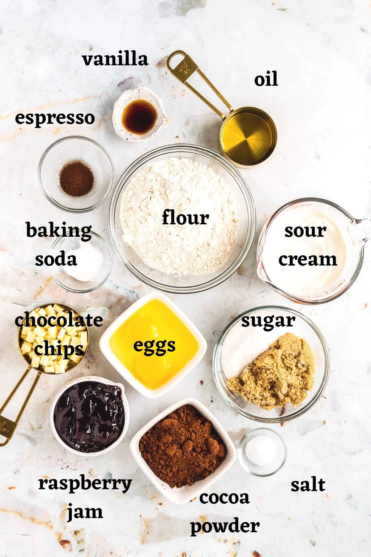 Ingredients needed to make white chocolate raspberry muffins.
