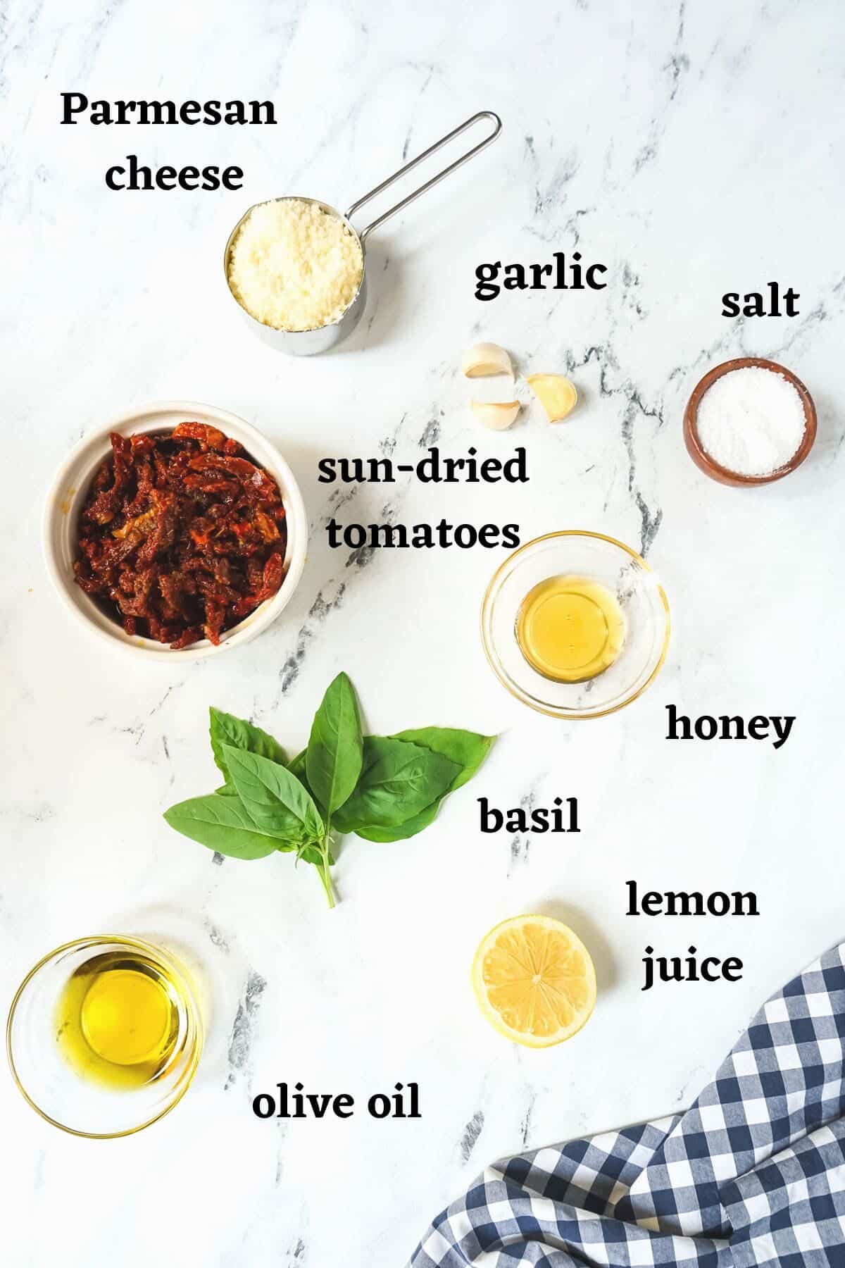 Ingredients needed to make Sun dried tomato pesto .