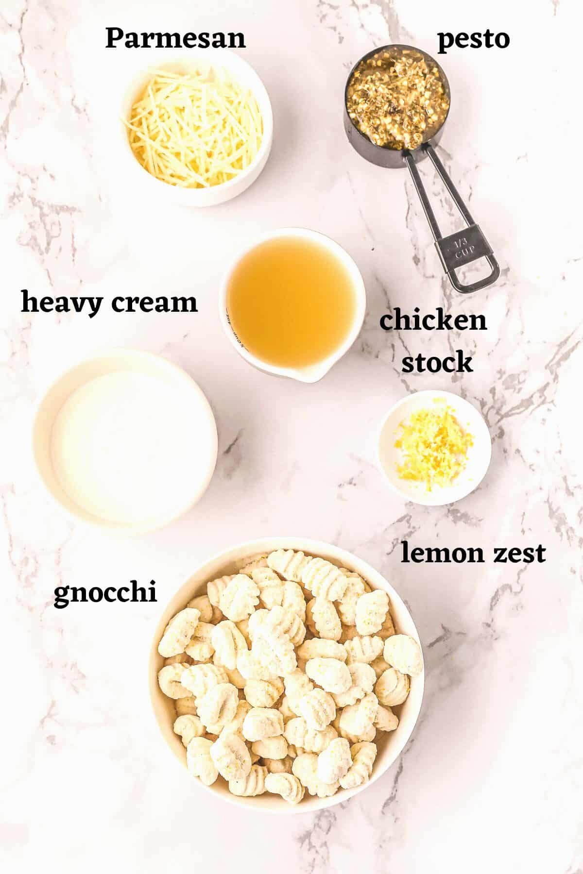 Ingredients needed to make creamy pesto gnocchi with lemon.