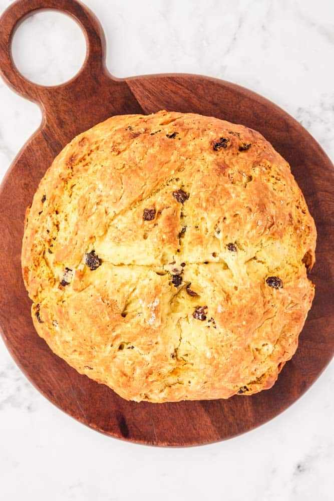 Irish Soda Bread without Buttermilk after it's been baked on a cutting board.