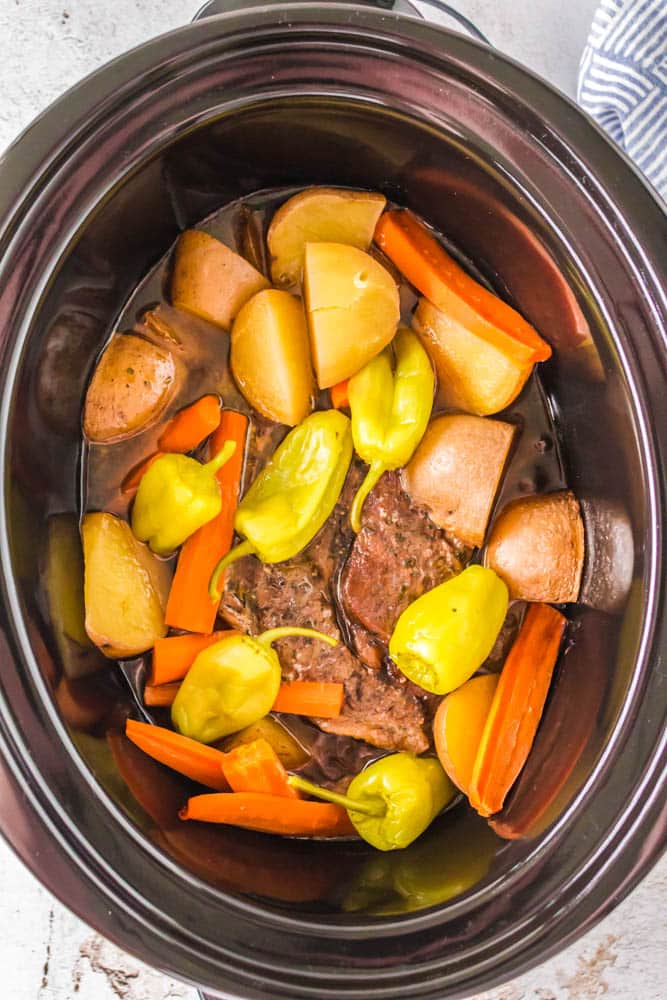Mississippi Pot Roast with Potatoes and Carrots in the crockpot, after being cooked.