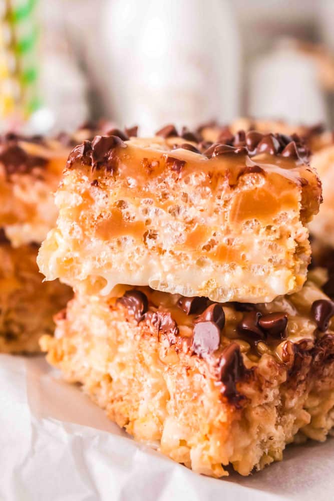Close up of Caramel Rice Krisipie treats stacked on top of one another.