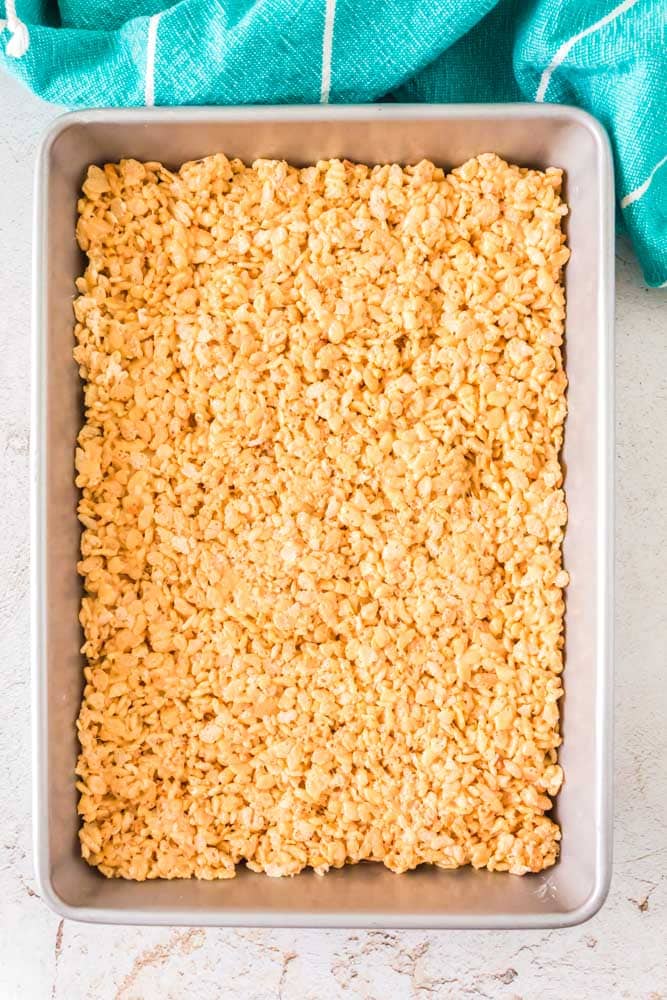 Peanut Butter Rice Krispie Treats in a pan with no chocolate.