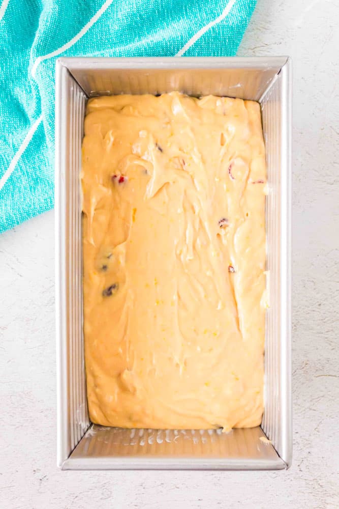 Cranberry Orange Pound Cake in a loaf pan before it's been baked. 