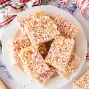 several peppermint rice krispie treats on a white plate