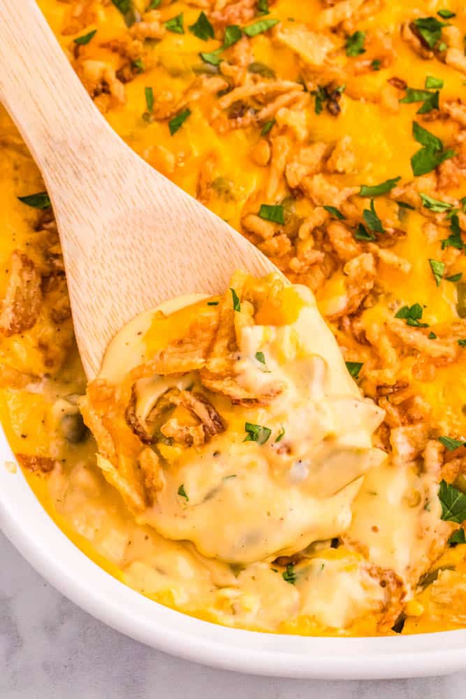 A spoonful of hot, cheesy Green Bean Casserole.