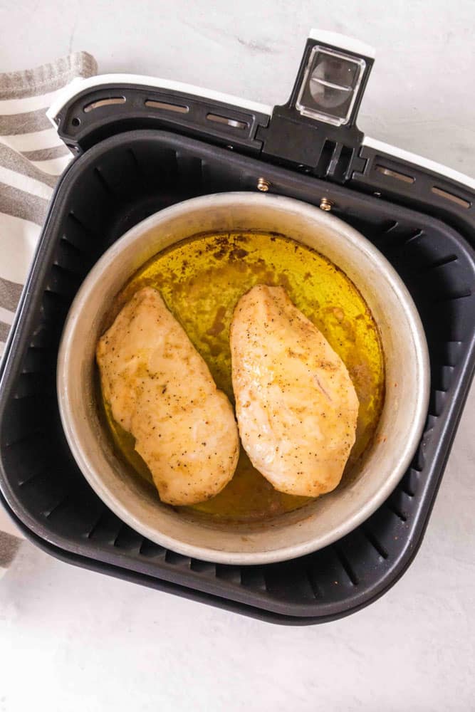 Cooked chicken breasts in the air fryer.