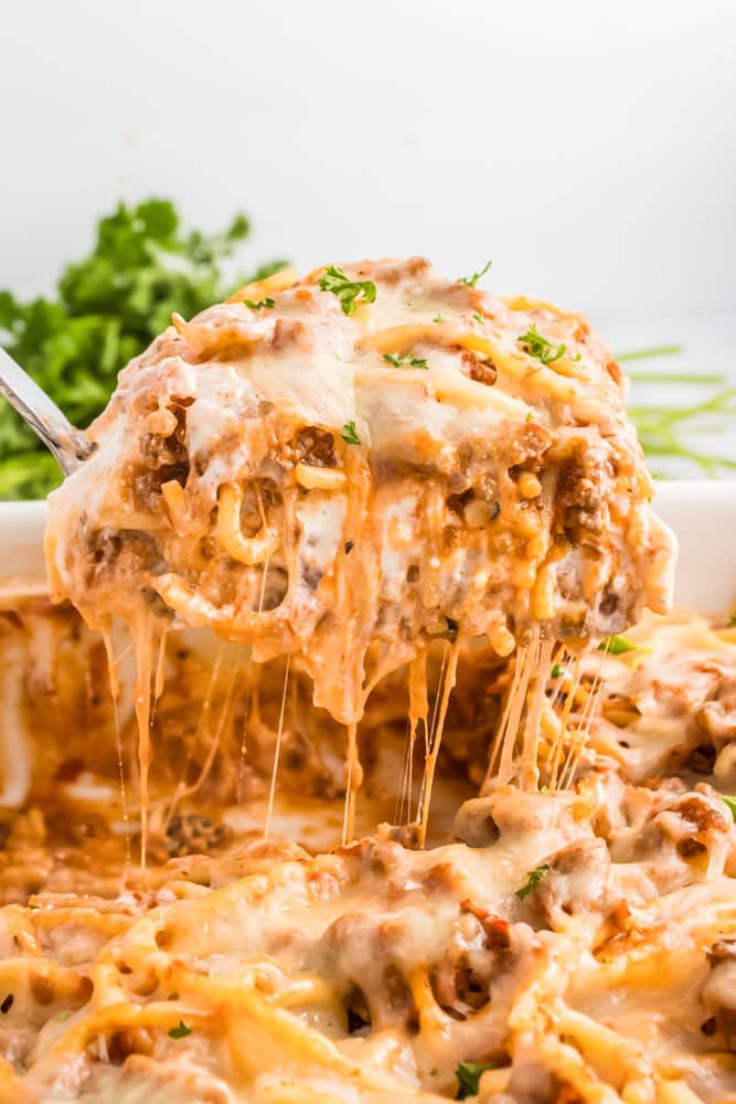 Baked spaghetti being served.